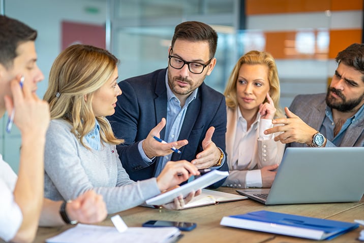 Man explaining computer information