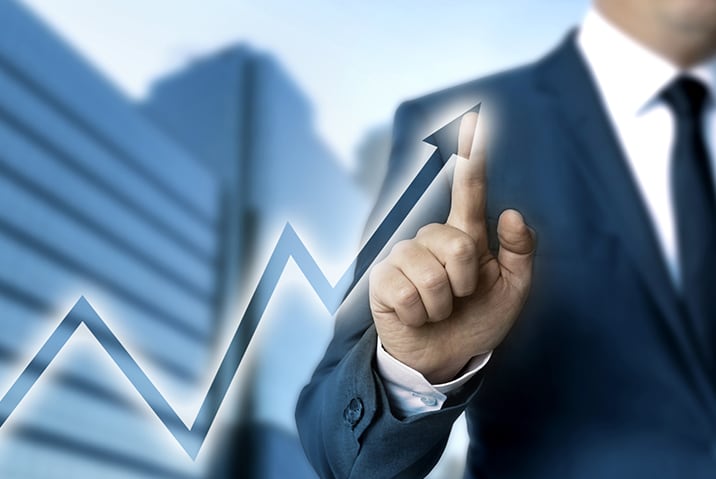 Mans finger following a graph line